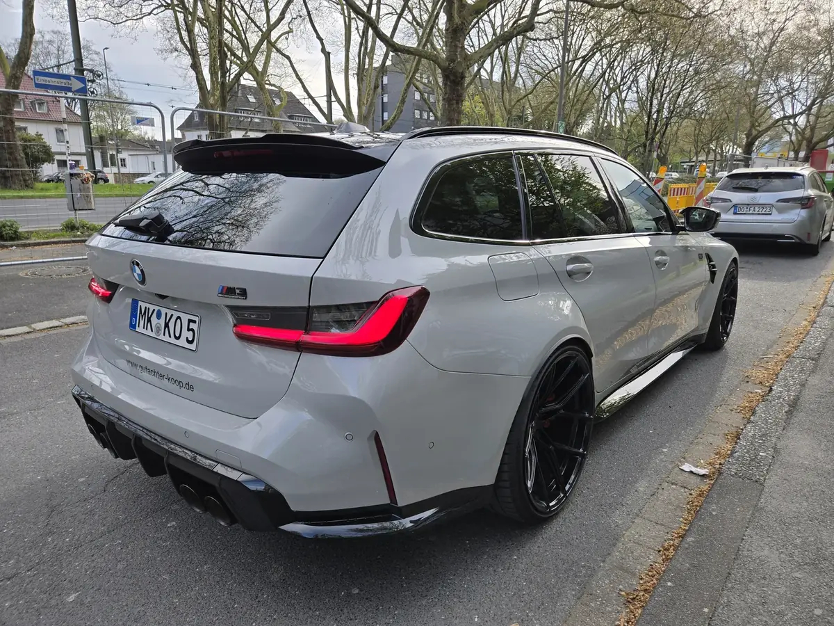 BMW M3 Competition Touring Heckansicht mit gutachter-koop.de Schriftzug
